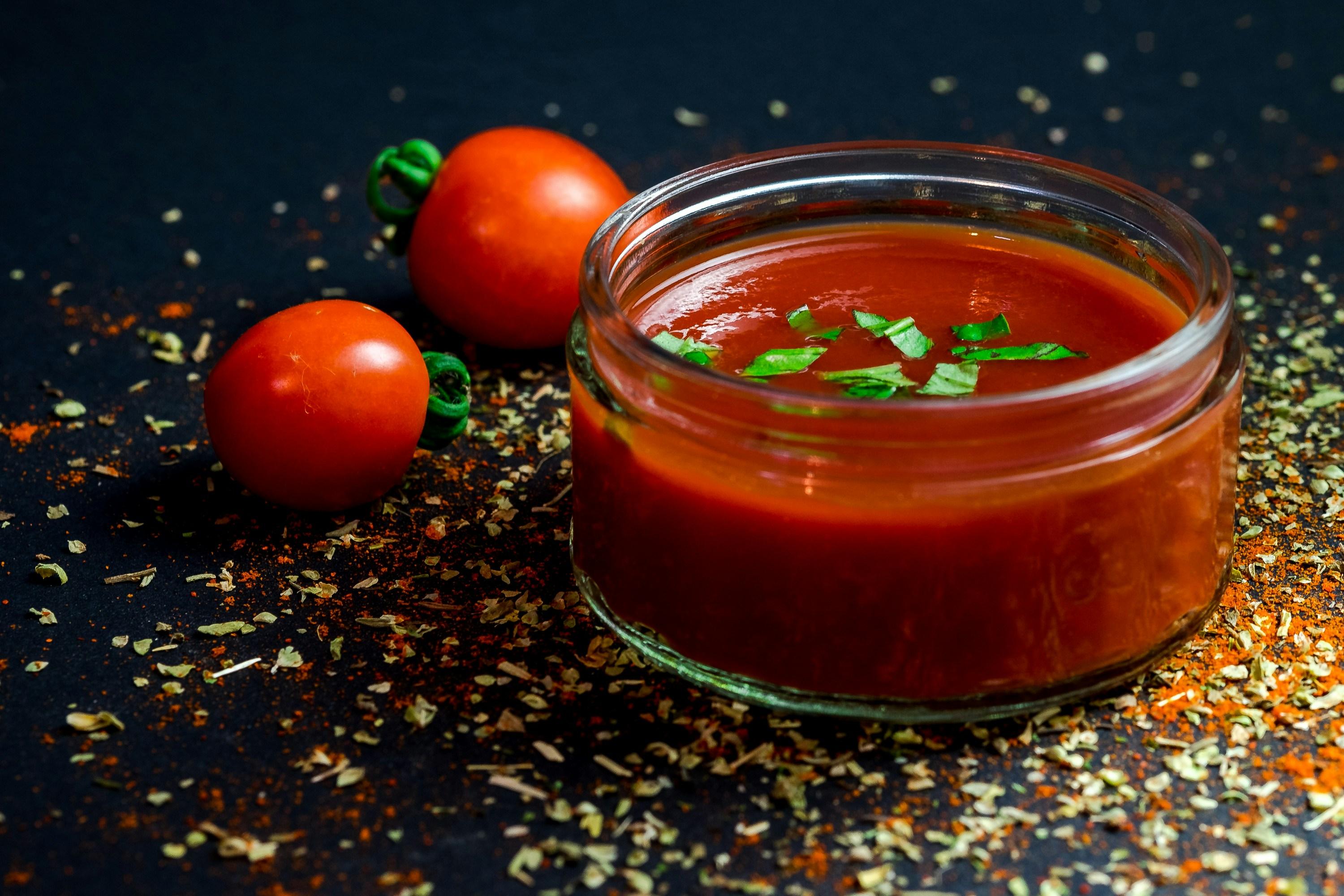 Hand-crushed San Marzano tomatoes with fresh basil leaves